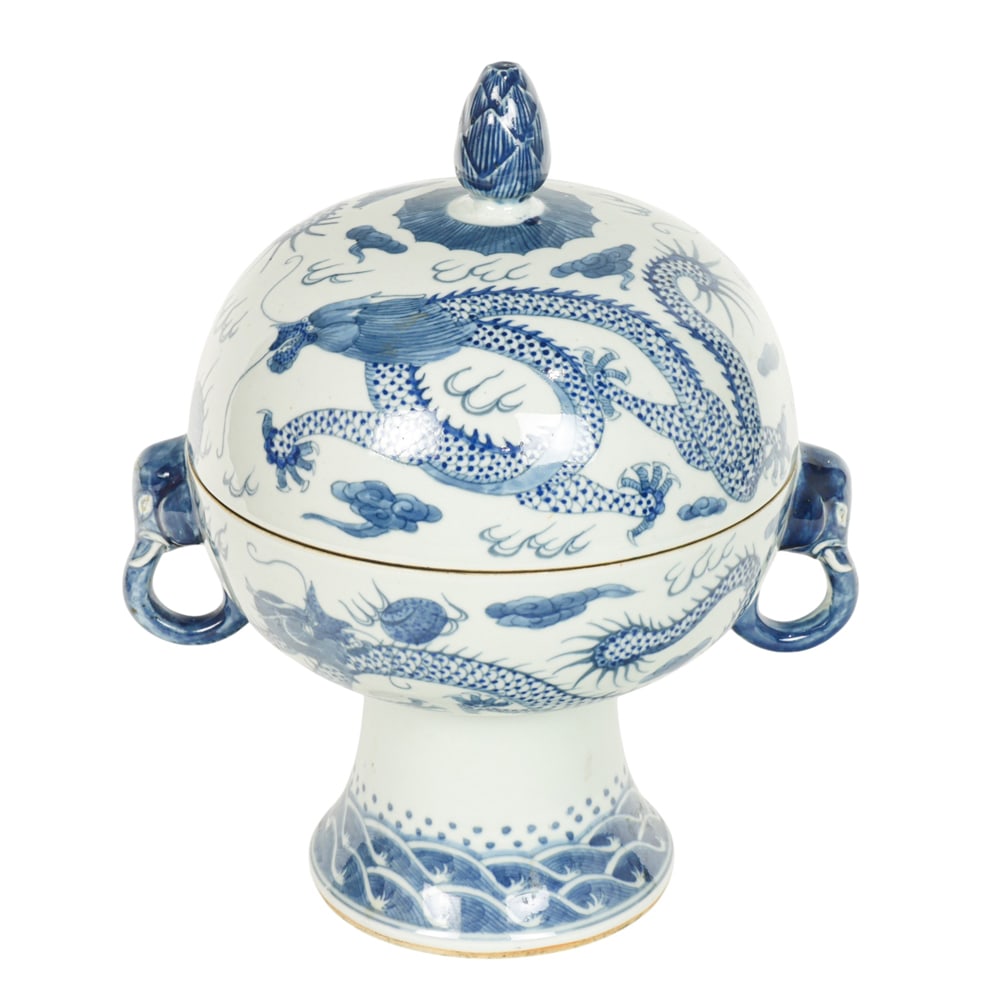 A Chinese blue and white covered stem bowl: A Chinese blue and white covered stem bowl. Featuring with a five-claw dragon chasing flaming pearl. flanked by a pair of elephant head loop handles, bearing Xuande six-character mark, early 20th cent
