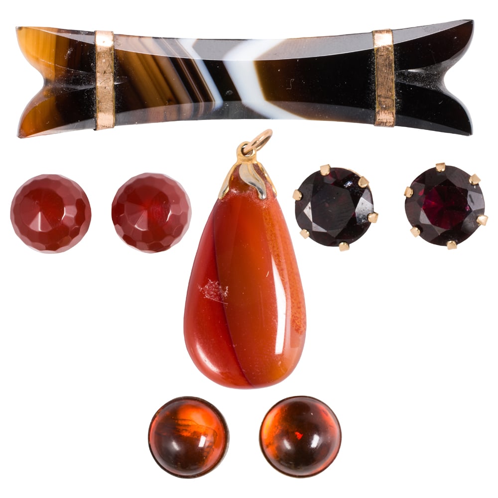 A group of hardstone jewelry: A group of hardstone jewelry Comprising a pin, pendant, and three pairs of earrings set with a variety of hardstones including agate; gross weight: 25.85 grams