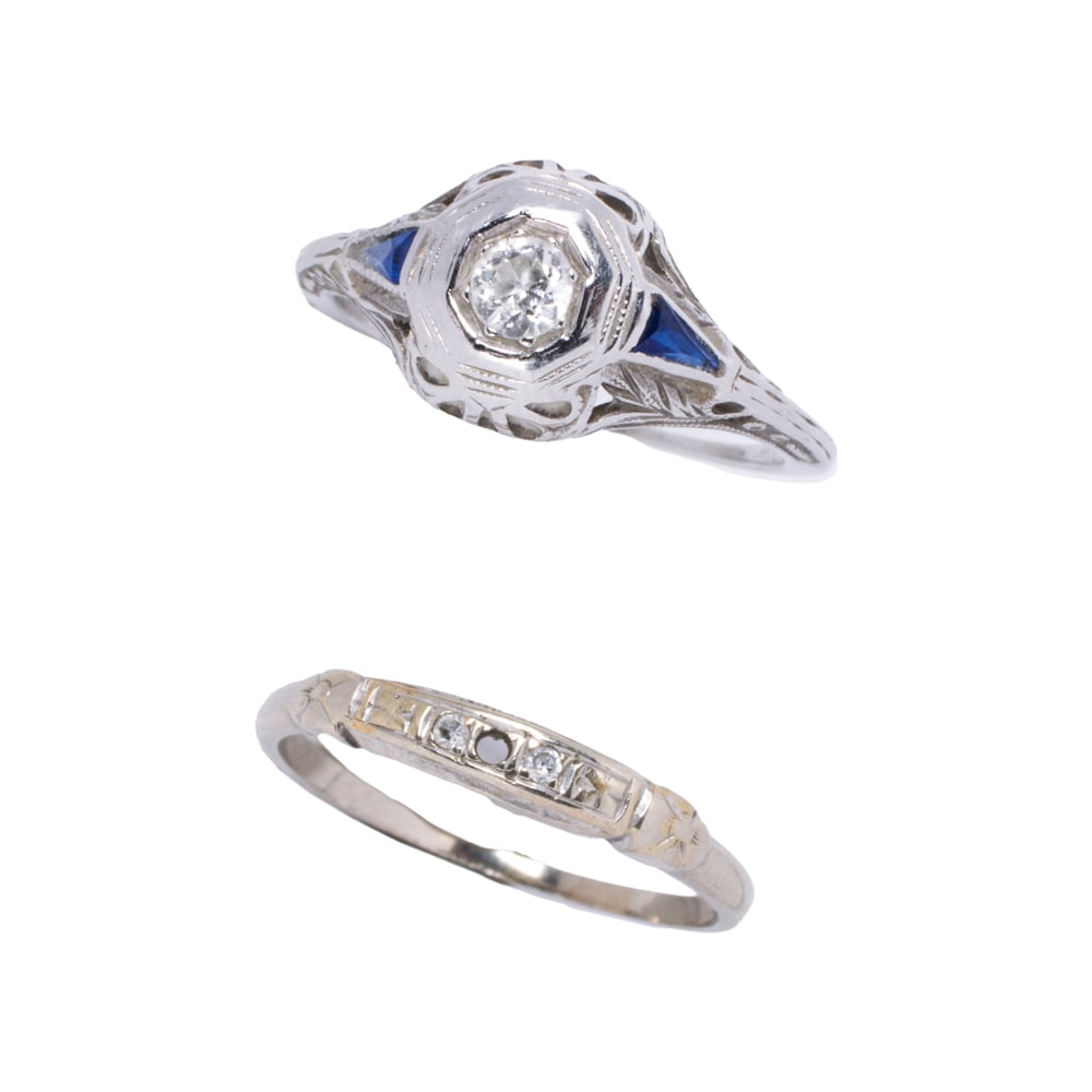 A set of Art Deco diamond and 14k white gold rings: A set of Art Deco diamond and 14k white gold rings Comprising one featuring an old mine-cut diamond weighing approximately 0.20 carat, framed on either side by a fancy-cut sapphire, together with one