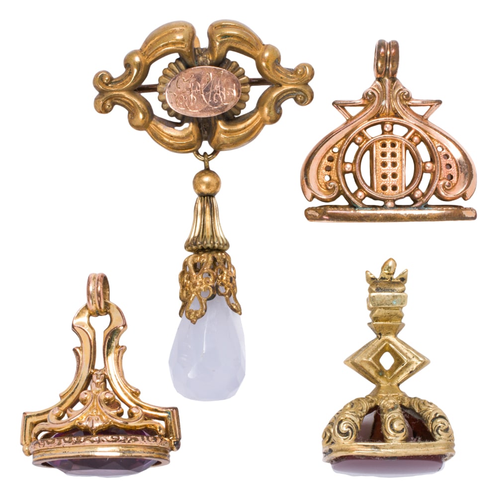 Four antique gold-filled watch fobs: Four antique gold-filled watch fobs The fobs of varying styles and materials; gross weight: 24.75 grams