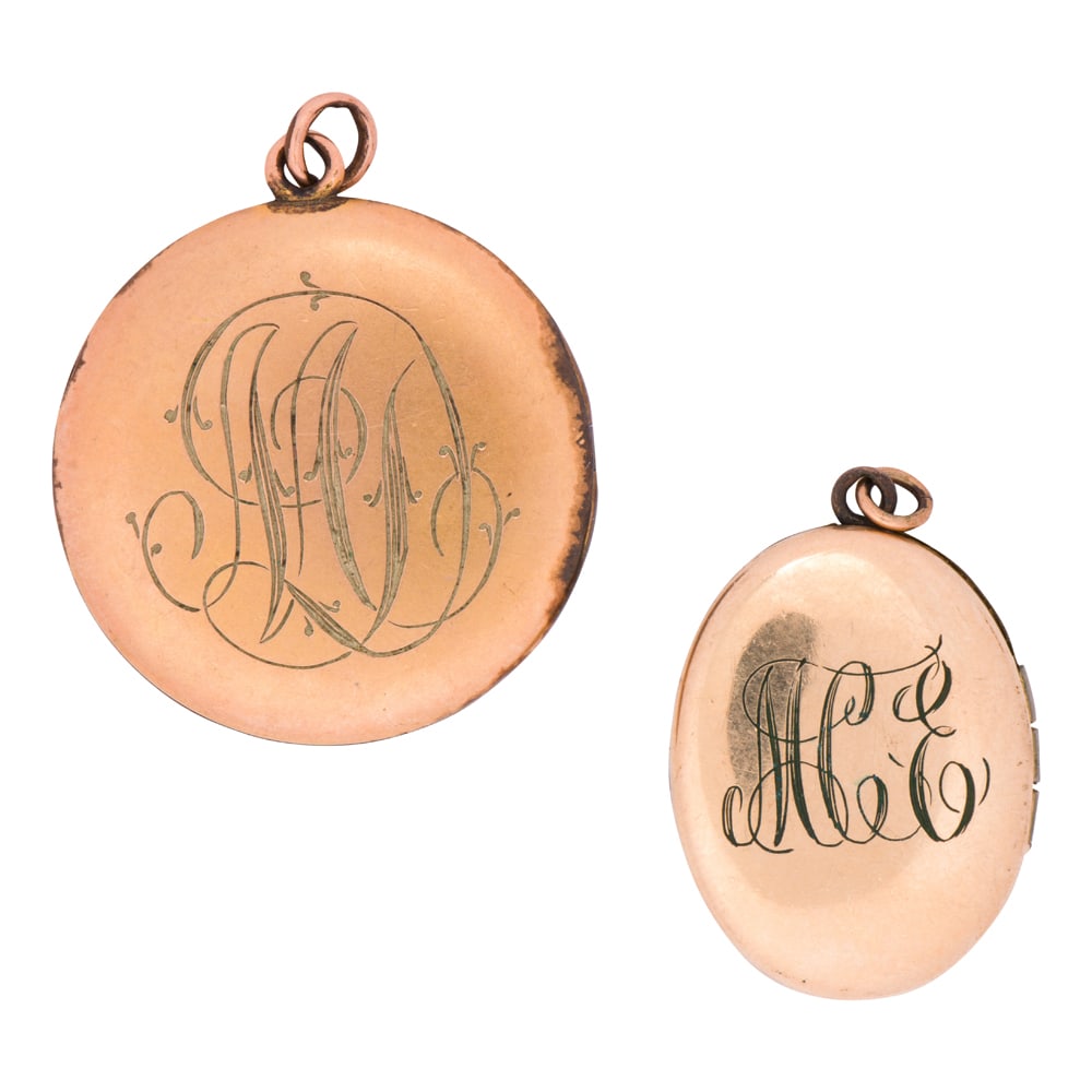 Two antique gold-filled lockets: Two antique gold-filled lockets Each monogrammed with one accented by floriform etching; lengths: 1 1/2 and 1 1/4 in; gross weight: 14.30 grams