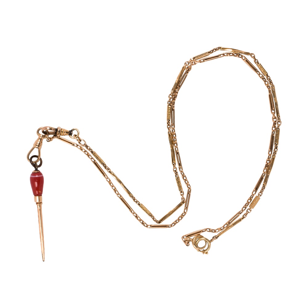 An antique gold-filled pocket watch chain and watch key: An antique gold-filled pocket watch chain and watch key The chain of fancy link design, featuring a hardstone-set watch key; chain length: 27 in; key length: 2 1/4 in; 19.85 grams
