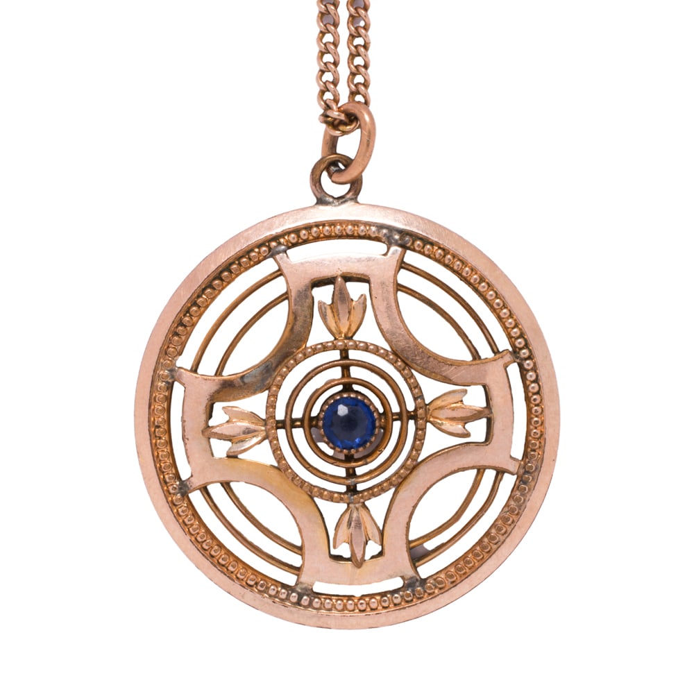 An antique paste and gold-filled pendant necklace: An antique paste and gold-filled pendant necklace Centering a round-cut blue paste stone in open-form frame; chain length: 20 in; pendant length: 1 in; 5.80 grams