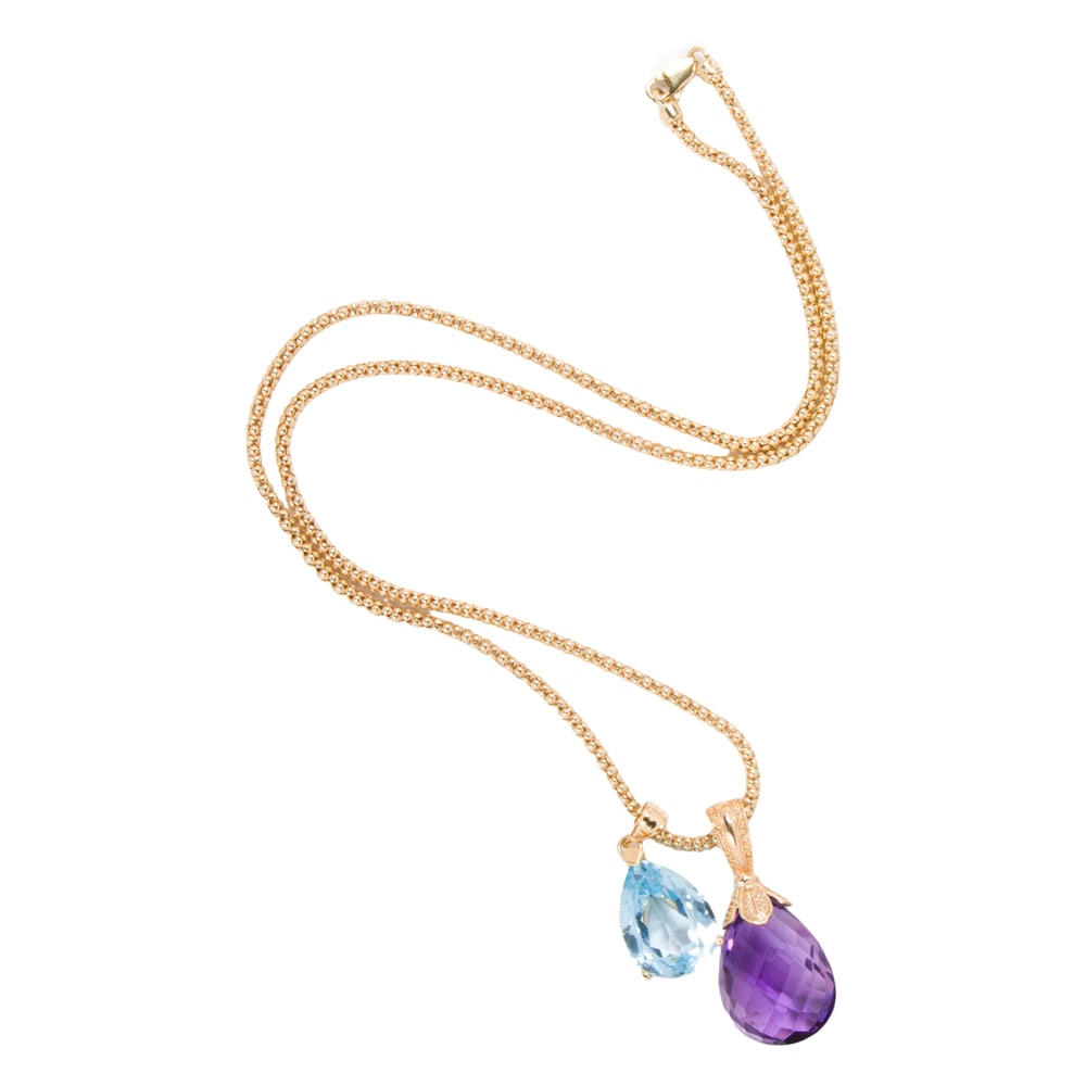 An amethyst, topaz, and 14k gold pendant necklace: An amethyst, topaz, and 14k gold pendant necklace Featuring one briolette-cut amethyst pendant and one pear-cut topaz pendant on 14k gold fancy link chain; pendant lengths: 1 1/4 and 1 in, respectivel