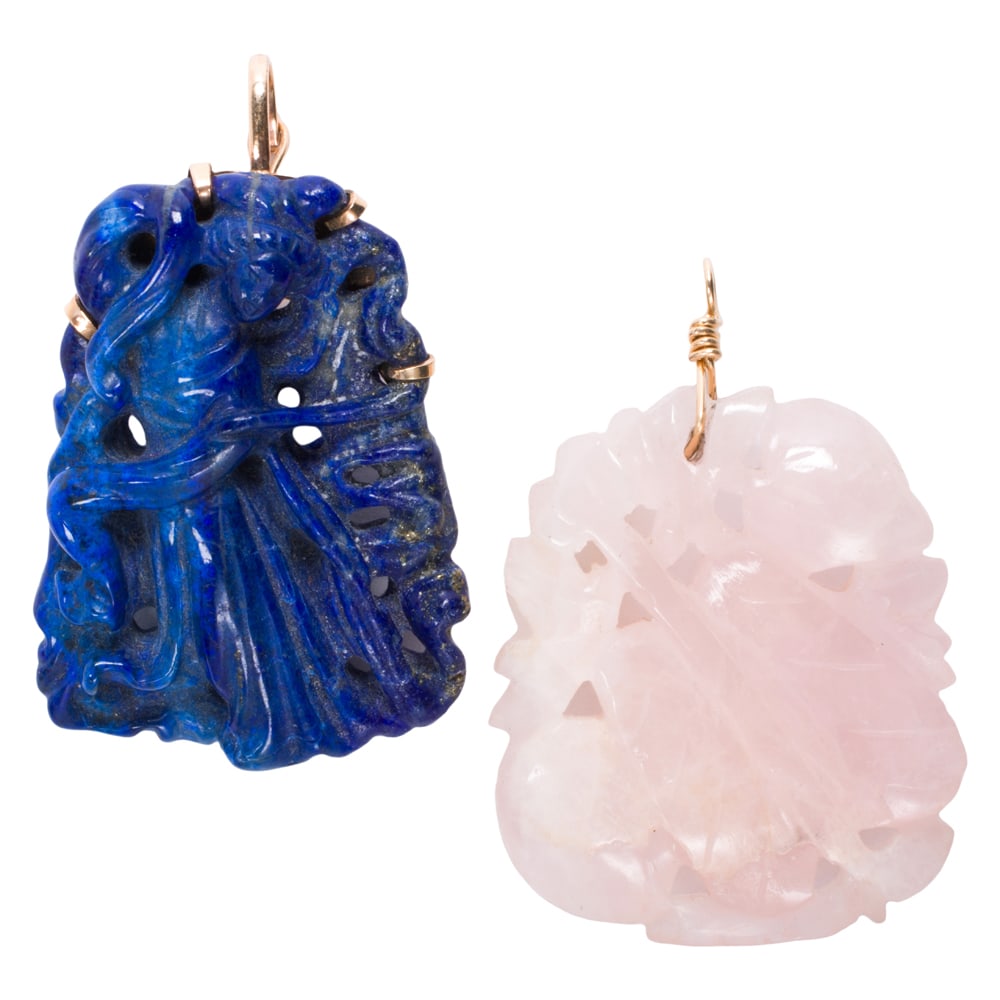 Two hardstone and 14k gold pendants: Two hardstone and 14k gold pendants Comprising one carved lapis lazuli pendant and one carved rose quartz pendant with 14k gold bails; gross weight: 38.70 grams