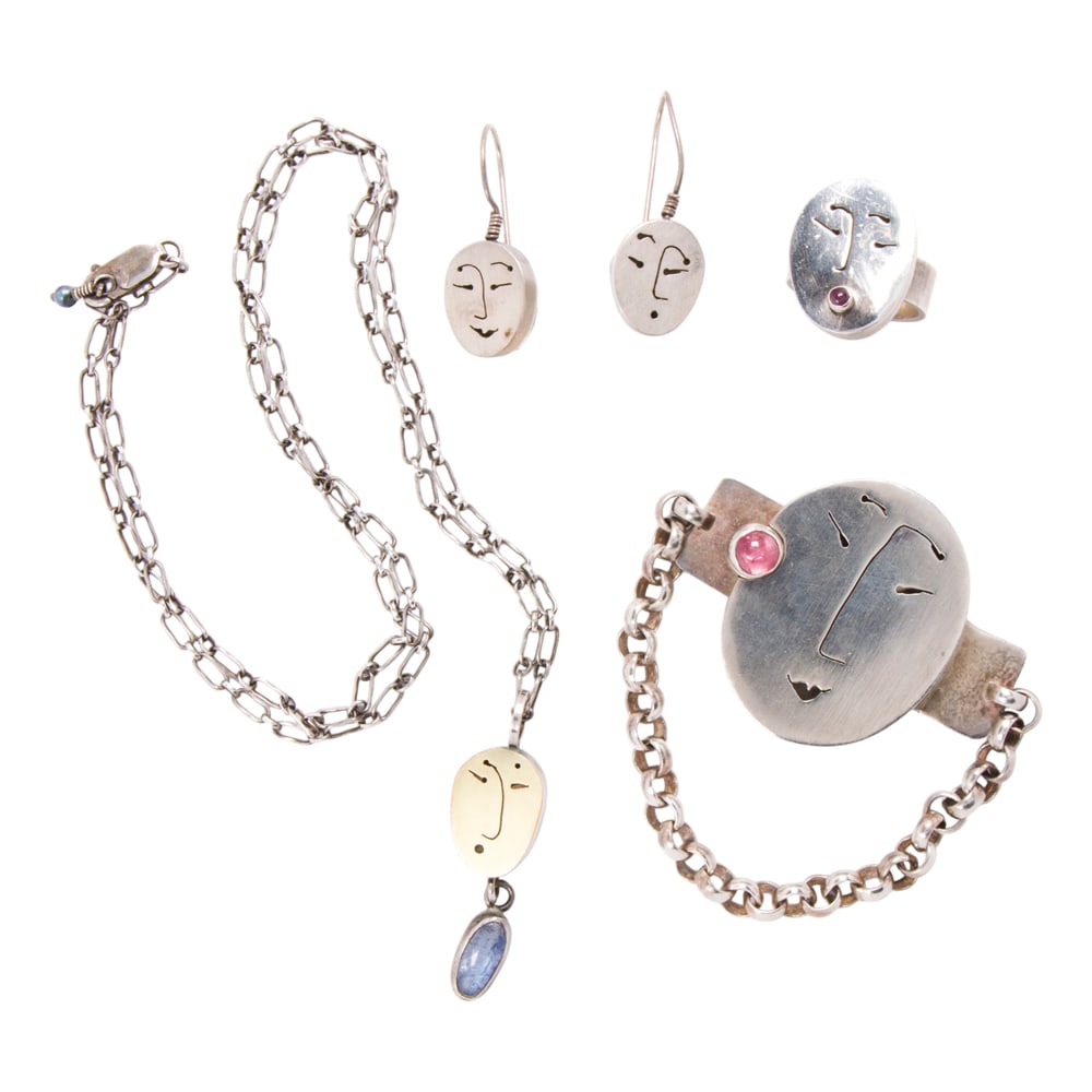 A gem-set and sterling silver group: A gem-set and sterling silver group Of modernist design, featuring a pendant necklace, pair of earrings, bracelet, and a ring set with a variety of gemstones; gross weight: 75.10 grams