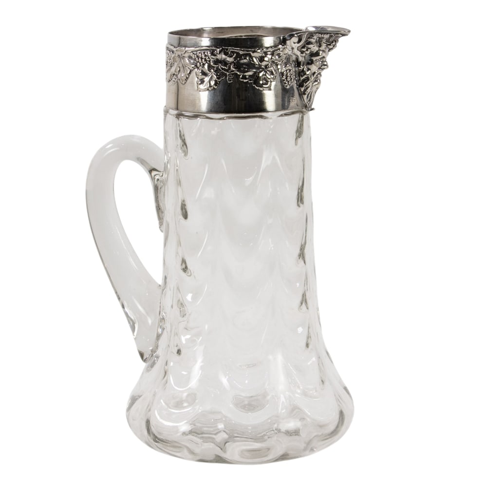 An American blown glass tall pitcher with silver collar mount: An American blown glass tall pitcher with silver collar mount, unmarked, H. 10 3/4 in.
