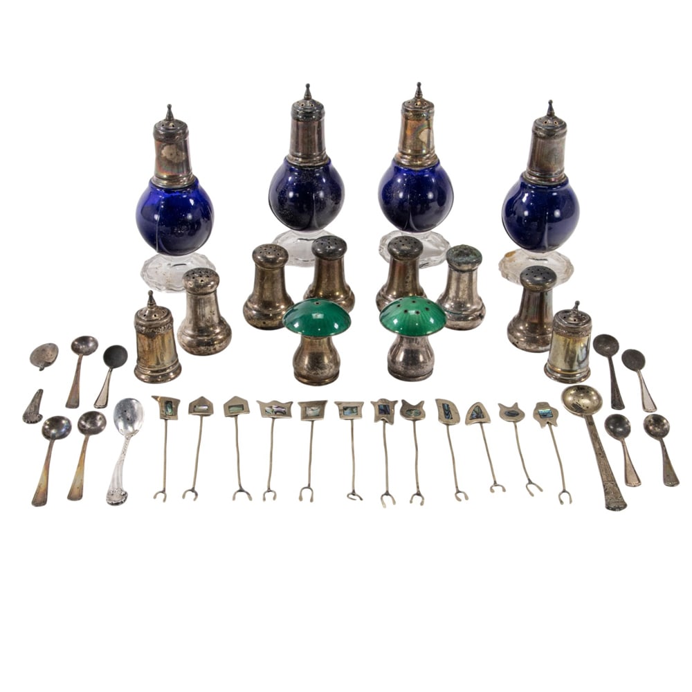 A quantity of sterling and sterling mounted casters, salt spoons, etc: A quantity of sterling and sterling mounted casters, salt spoons, etc., comprising: set 4 glass casters with sterling lids and pr. extra lids; Danish sterling and enamel novelty pr. casters; set 6 ind