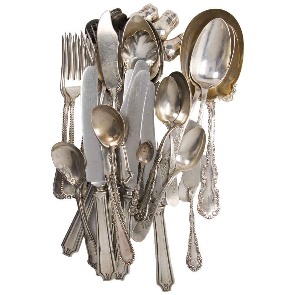 A sterling flatware group: A sterling flatware group, comprising: 6-7 3/8 in forks, 1 butter serving knife and 1 sugar spoon, International, Cambridge; 4 tablespoons and 3 teaspoons, Towle, Gladys; 1 berry spoon, Whiting Mfg Co
