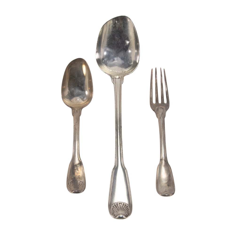 Three pieces of French silver flatware: Three pieces of French silver flatware, 18th century, comprising: large serving spoon, table fork and tablespoon in variations of the Fiddle pattern, including two with armorials. (10.85 oz t.)