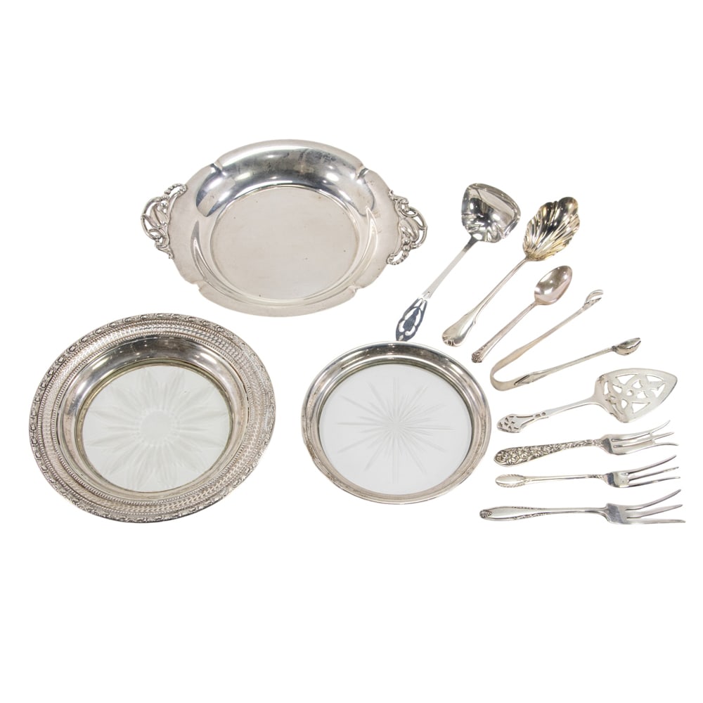 A sterling bowl in the Jensen taste, without maker's mark: A sterling bowl in the Jensen taste, without maker's mark, D. 6 1/2 in with sterling 3 assorted lemon forks by Frank Whiting, International and Manchester, pair sugar tongs by Gorham, monogrammed: L, 