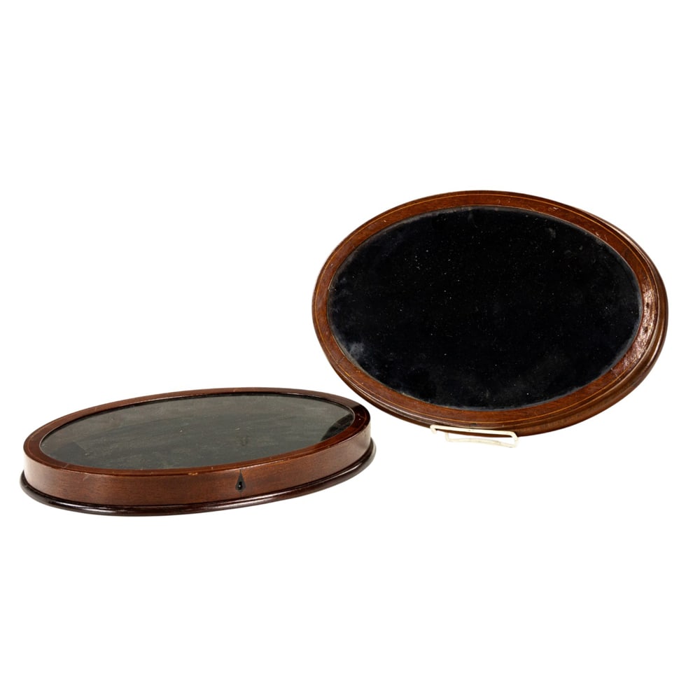 A pair of line inlaid mahogany oval jewelry display cases: A pair of line inlaid mahogany oval jewelry display cases, each with hinged glazed top, 1.5"h x 15"w x 10"d