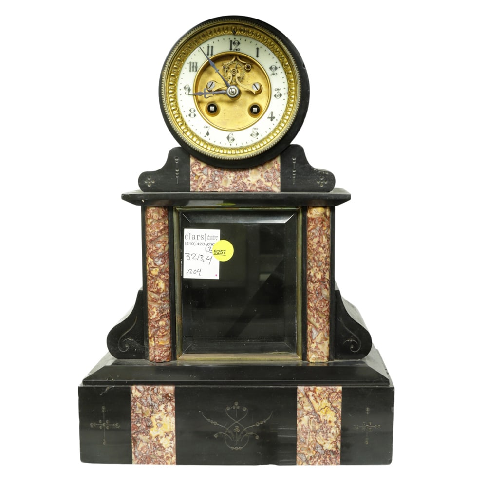 A French slate and marble mantel clock: A French slate and marble mantel clock, late 19th century, the dial with open escapement, time and strike movement sounding on a bell, housed within a drum raised on upright case with glass door and s