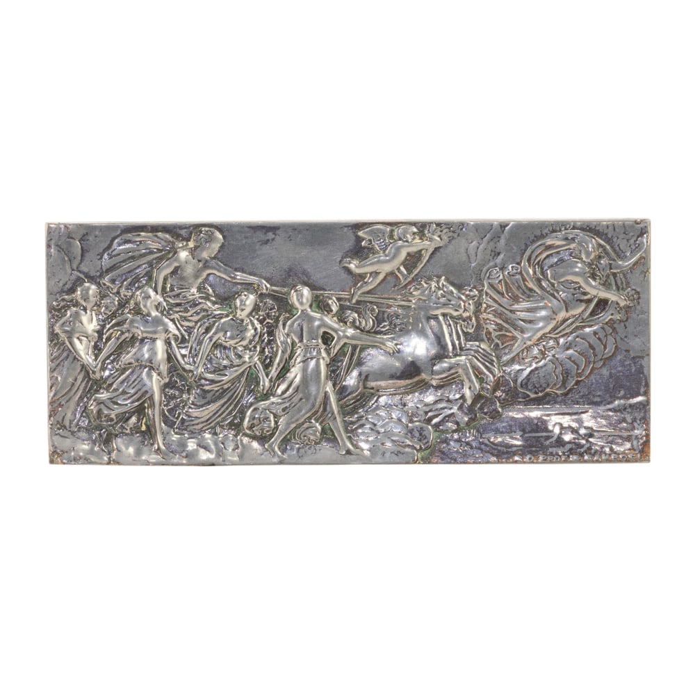 An Italian silvered metal relief plaque depicting Apollo driving his chariot: An Italian silvered metal relief plaque depicting Apollo driving his chariot, Editore R. Convalle, Florence, mid-20th century, the rectangular low-relief panel stamped 'EDITORE R. CONVALLE FIRENZE / V