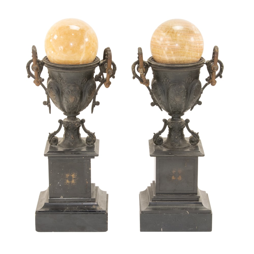 A pair of Victorian patinated metal and black slate mantel urns: A pair of Victorian patinated metal and black slate mantel urns, together with honey calcite stone spheres, urns 13.5"h