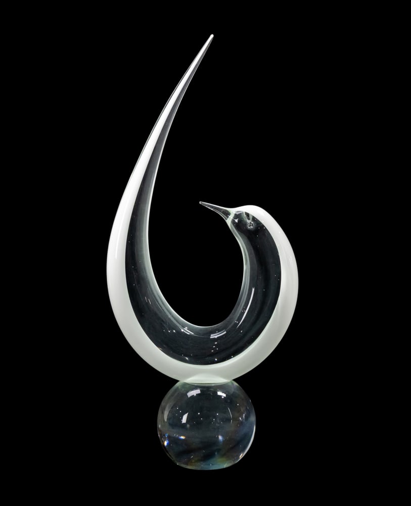 A Murano glass figure of a bird, Renato Anatra: A Murano glass figure of a bird, Renato Anatra, circa 1970s, worked in clear and white and raised on a globular plinth, engraved signature, 20.75"h