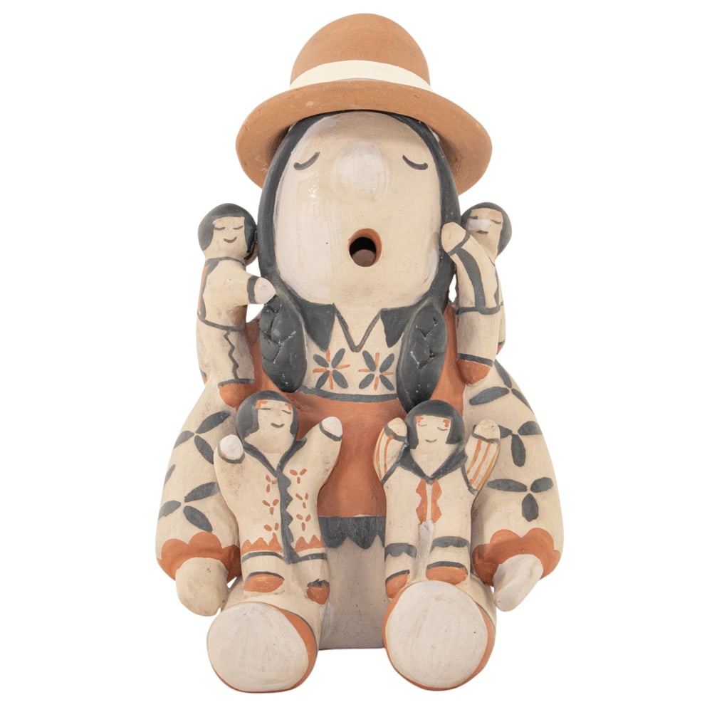 A Mary and Leonard Trujillo (Cochiti Pueblo) pottery storyteller figural group: A Mary and Leonard Trujillo (Cochiti Pueblo) pottery storyteller figural group, the seated figure modeled with four children, signed ' Mary & Leonard Trujillo, Cochiti Pueblo', 9"h