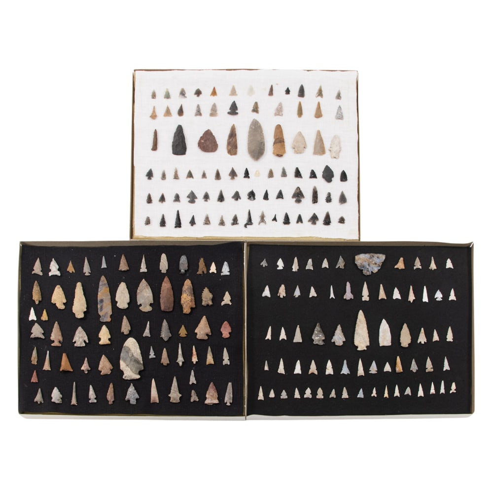 A group of three display cases containing early Native American arrowheads and points: A group of three display cases containing early Native American arrowheads and points, each case 11"h x 14"w