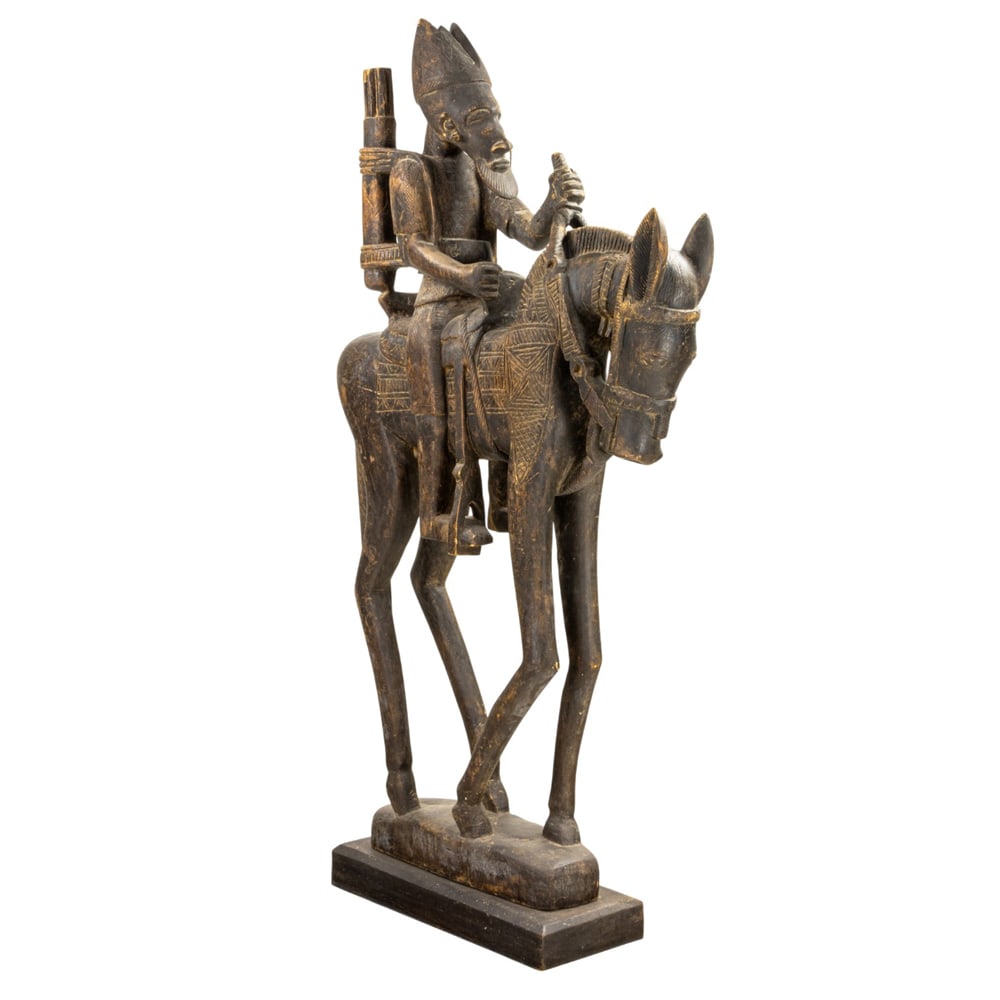 A large African carving of a horse and rider: A large African carving of a horse and rider, 73.5"h x 11"w x 28"d (base)