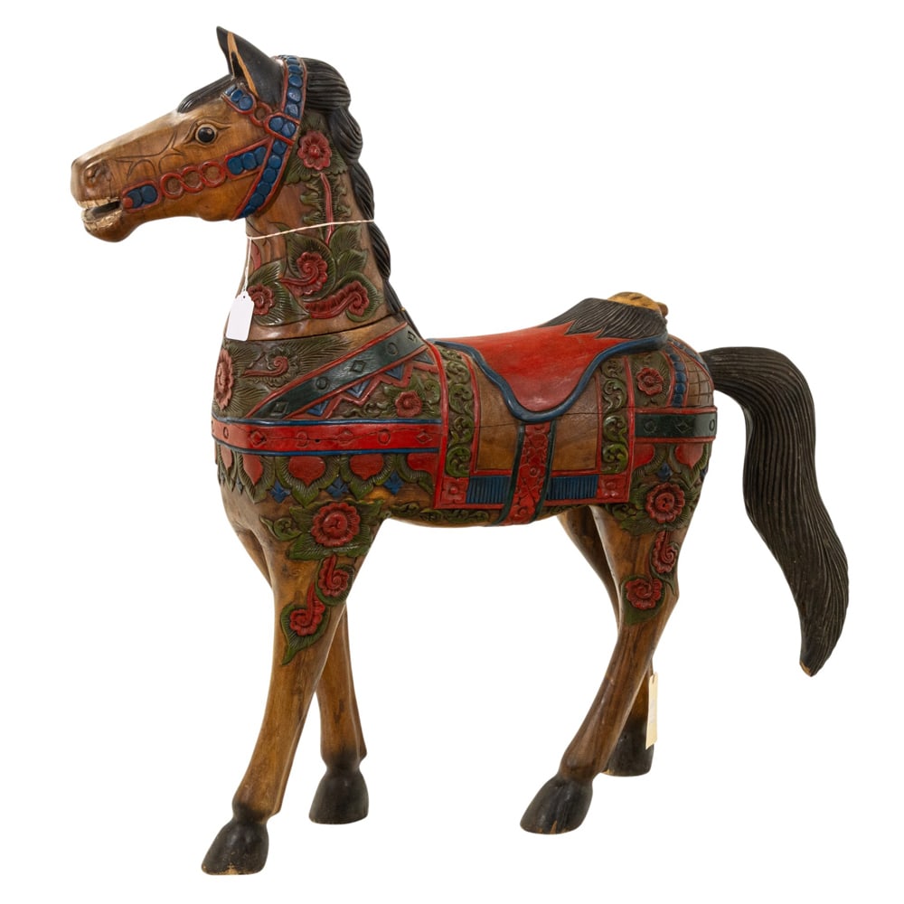 A Mexican carved and paint decorated carousel style horse: A Mexican carved and paint decorated carousel style horse, 49.5"h x 11"w x 32"d