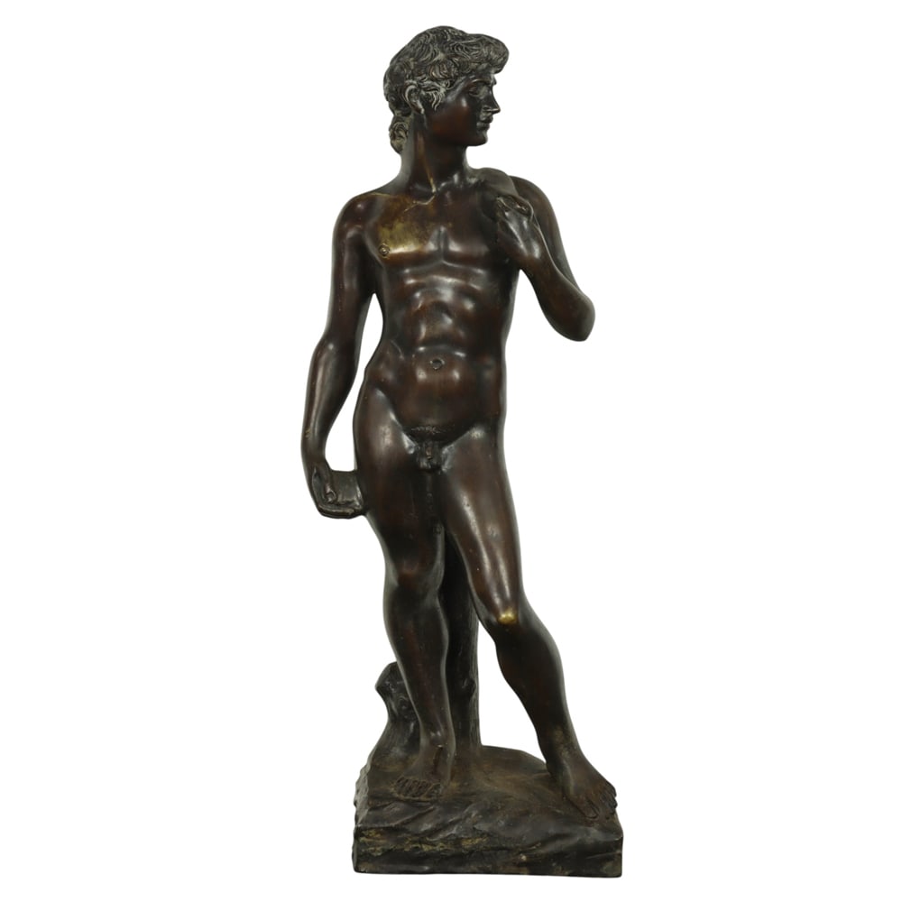 A Continental patinated bronze figure of David after Michelangelo: A Continental patinated bronze figure of David after Michelangelo, late 19th/early 20th century, unmarked, 21"h