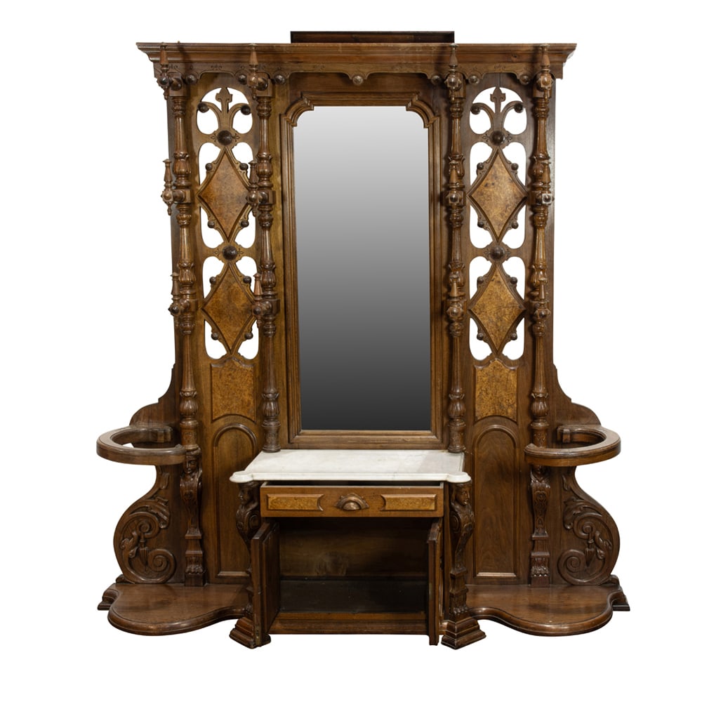 An American Renaissance Revival etagere: An American Renaissance Revival etagere, circa 1870, executed in walnut and walnut burl, with twelve coat hooks flanking the original looking glass continuing to the original Carrara marble top, and