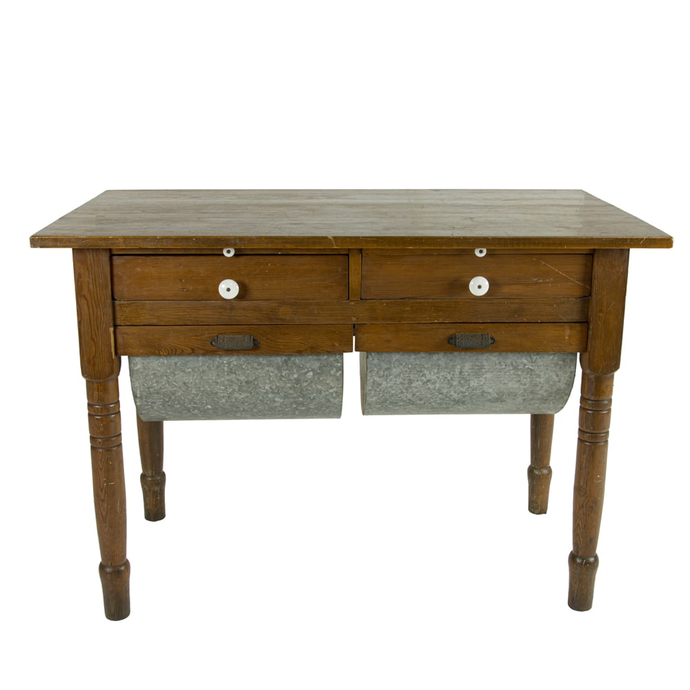 An American oak baker's table: An American oak baker's table, early 20th century, fitted with two drawers over two metal lined drawers, 29.5"h x 42"w x 24"d