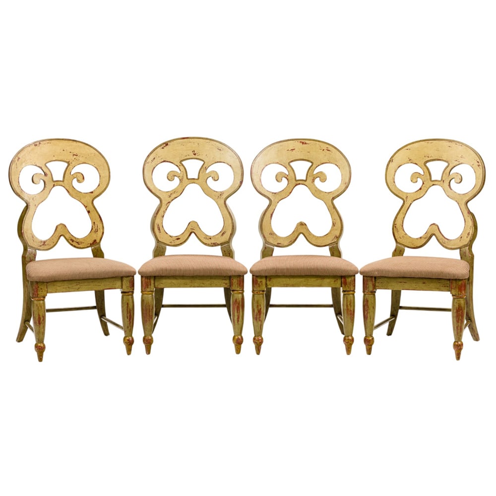 A set of four large contemporary Austrian inspired side chairs: A set of four large contemporary Austrian inspired side chairs, each with an antiqued polychrome finish and a shaped pretzel heart back, 42"h x 21"w x 18"d (overall); 18"h x 17"d (seat)