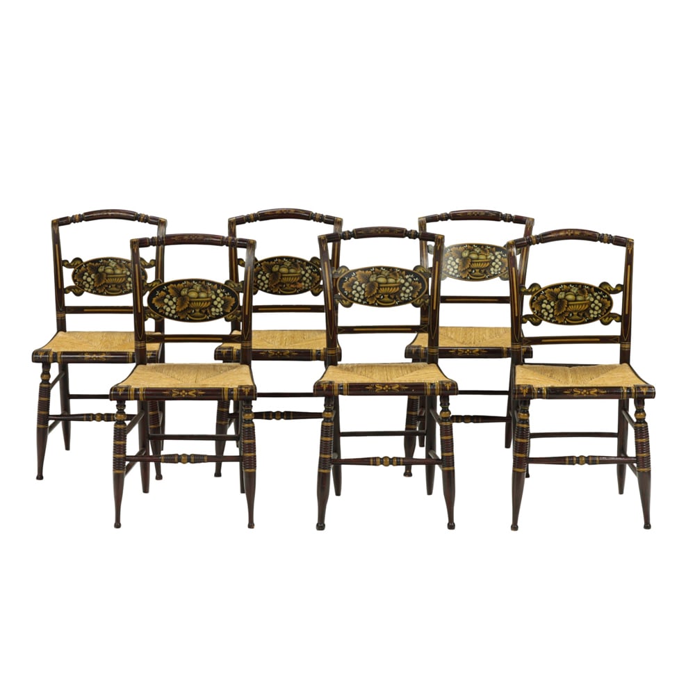 A set of six English Hitchcock harvest chairs: A set of six English Hitchcock harvest chairs, the frames with stencil and faux grain painted surface, rush seat, and rising on turned legs, 34"h x 17"w x 15.5"d (overall); seat 18"h