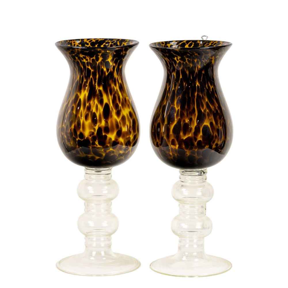 A pair of contemporary tortoiseshell glass hurricane vases: A pair of contemporary tortoiseshell glass hurricane vases, each raised on double knopped clear glass stem, 20.5"h
