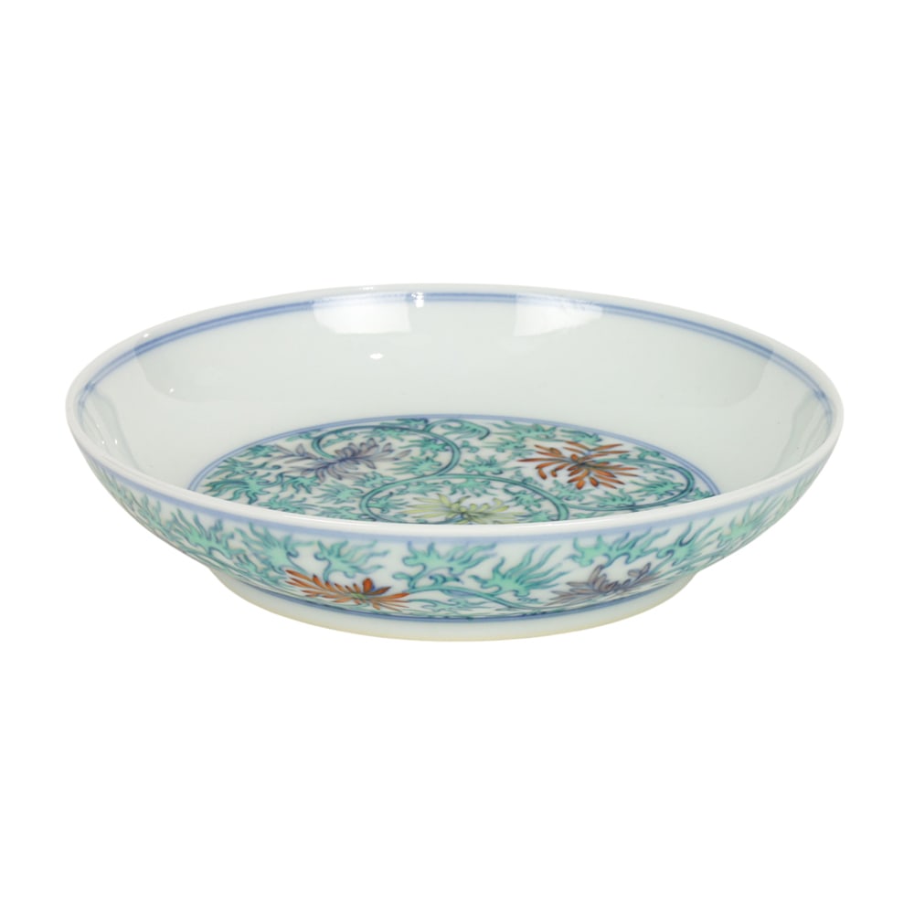 A Chinese doucai dish: A Chinese doucai dish. Featuring lotus design, bearing Qianlong six-character mark 6.125" across.
