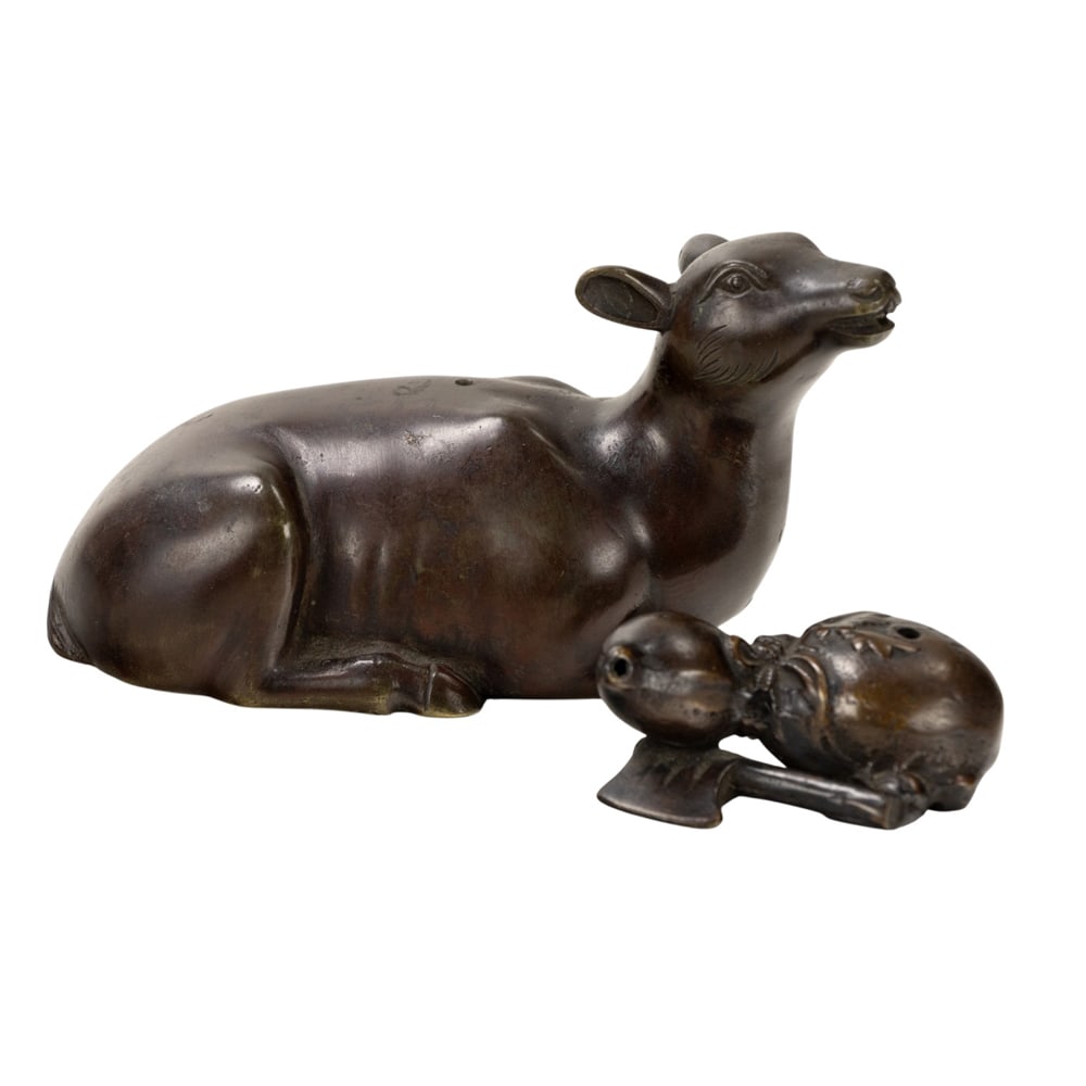 (lot of 2) Chinese bronze objects: (lot of 2) Chinese bronze objects. Comprising a deer and a double-gourd, from 2.5" to 5.75" across.