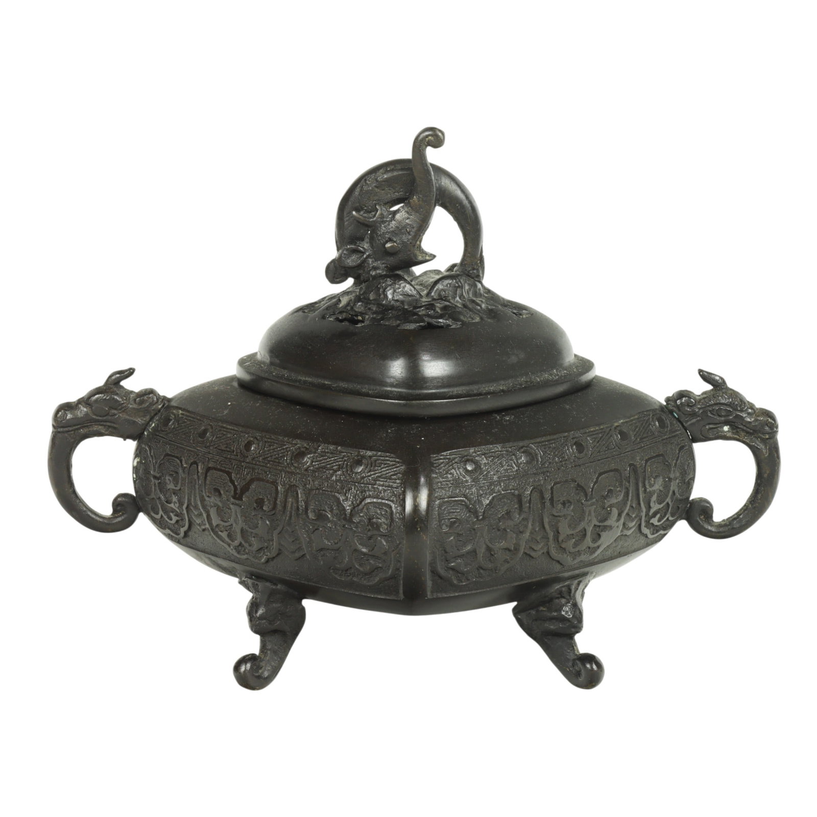 A Chinese bronze tripod censer: A Chinese bronze tripod censer. Featuring an elephant finial, and a pair of chilong handle, 6.5" high.