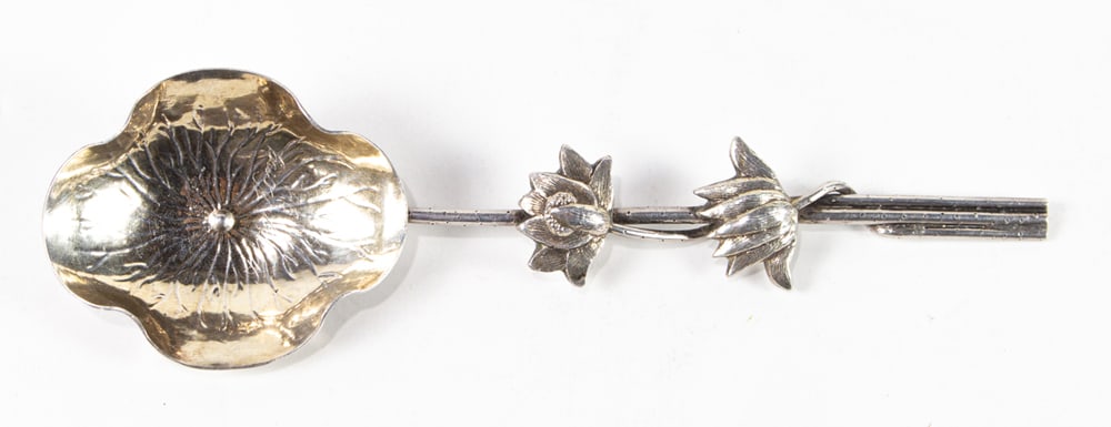 A Chinese export silver sterling spoon: A Chinese export silver sterling spoon. Marked Wang Hing, Hong Kong, circa 1920, 53 grams, 7.5" across.