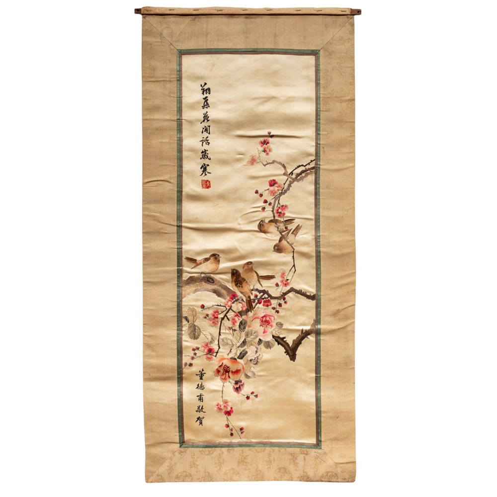A Chinese embroidered silk panel: A Chinese embroidered silk panel. Depicting a group of small birds perched among flowering peony, with calligraphic inscriptions, Republic period, 39.25"h x 14"w.