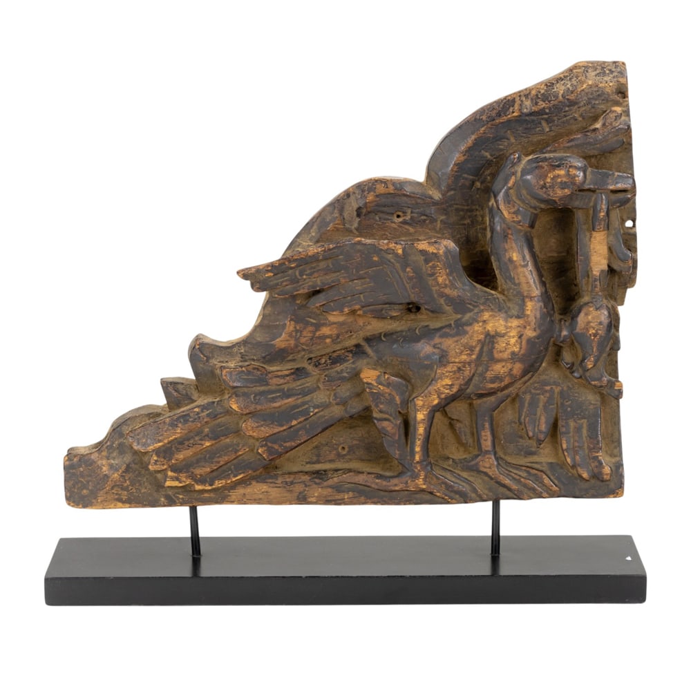 An Asian wood cared and gilt architectural fragment: An Asian wood cared and gilt architectural fragment. 13" high including stand.
