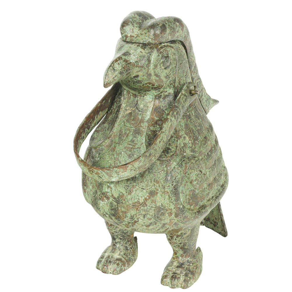 A Chinese archaistic bronze phoenix-form vessel: A Chinese archaistic bronze phoenix-form vessel. 20th century, 9.625" high.