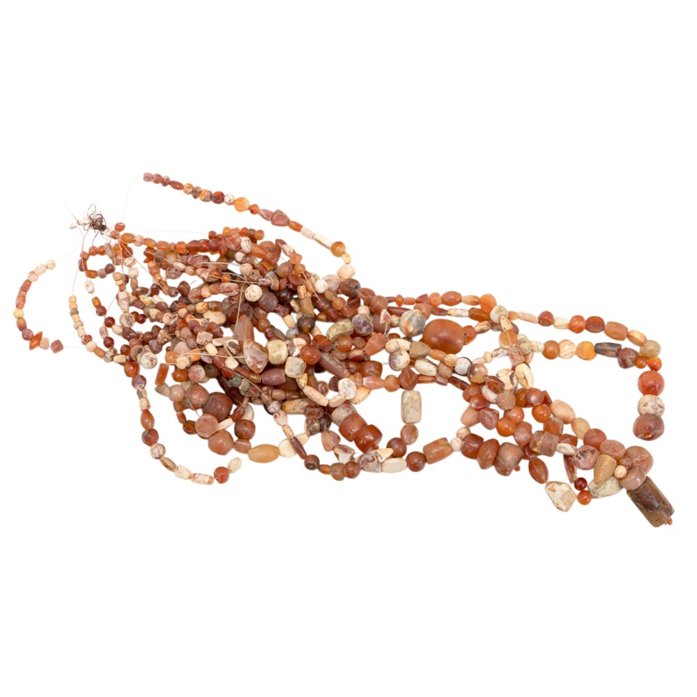 A group of Central Asian carnelian beads: A group of Central Asian carnelian beads. Each beads from 0.125" to 0.875" across.