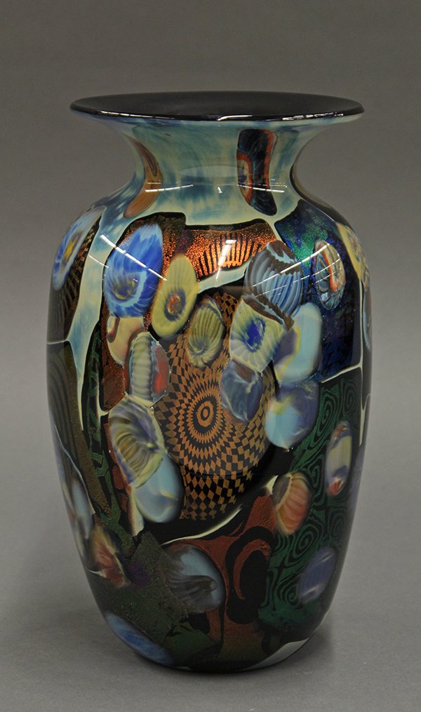 Specimen blown glass vase: Peter Vanderlaan and Mary Beth Bliss (American 20th century) art glass vase. Of urn form with a flared lip executed in blown glass cased over black with zanfirico, cane murrine and applied decoration 