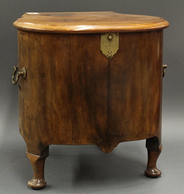 Queen Anne style cellarette: Queen Anne style cellarette, 19th century, executed in walnut, the single board top opening to the tin lined and fitted interior, the exterior of bulbous form retaining the original hardware, and havi