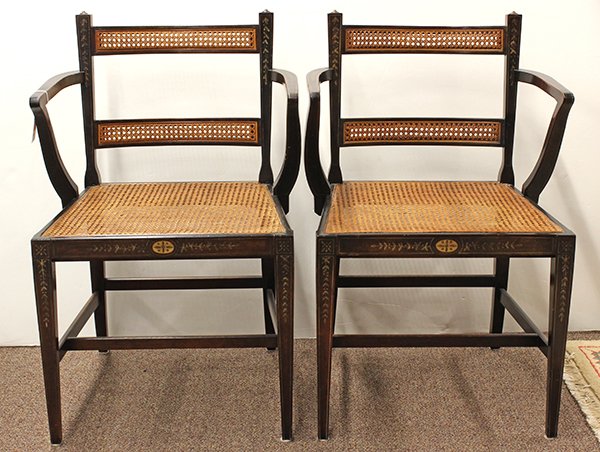 Pair of Federal style paint decorated fancy chairs: Pair of Federal style paint decorated fancy chairs, having a cane back and seat foundation centering the paint decorated frame accented with bellflower and vine sprays, rising on square tapered legs c