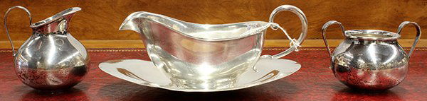 American sterling silver table accessories: (lot of 4) American sterling silver table accessories consisting of a sauce boat and stand by Amston; together with bulbous form open sugar and creamer by International, 15 troy oz