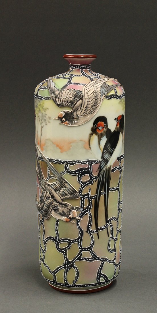 Japanese Handpainted Vase 19-20c.: Japanese porcelain vase, with a small mouth on a short neck, decorated with swallows in moriage, base marked with a maple leaf and 'Nippon, Hand Painted', 8.5"h