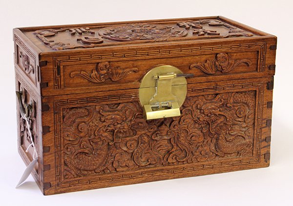 Chinese Carved Wood Trunk: Chinese wooden small trunk, carved with a dragon roundel, flanked by a four character auspicious phrase and four bats, the front of the chest further carved with meandering dragons, 17.6"w