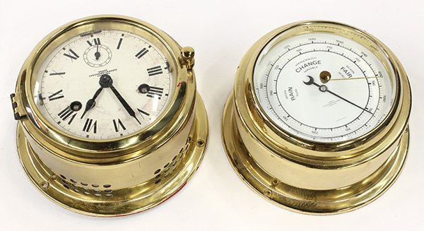 Wempe Chronometerwerke, Hamburg, barometer and clock: (lot of 2) Wempe Chronometerwerke, Hamburg, barometer and clock each housed in a brass case, the clock having Roman markers, each: 6"h x 3"w, Provenance: Property from the collection of Dr. Greg and P