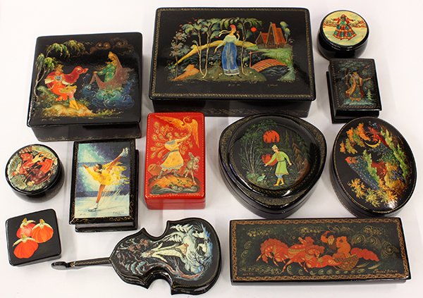 Russian style ebonized wood boxes: (lot of 12) Collection of mostly Russian laquered wood boxes, each depicting various images including genre scenes, largest: 1.75"h x 7"w x 5"d. Provenance: Property from the collection of Dr. Greg an