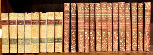One shelf of books including George Eliot: (lot of 22) One shelf of books including eight volumes of George Eliot's Works including Adam Bede, Middlemarch, etc., published by Hurst & Company, New York,; together with Stoddard's Lectures, volum