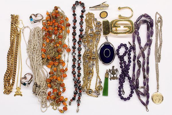 Collection of costume jewelry, including one gold: Collection of costume jewelry, including one gold plated Gucci belt buckle; six bead necklaces; one vintage gold filled nephrite pendant; together with miscellaneous plated items.