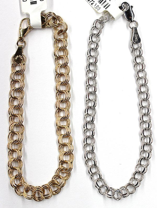 Yellow white gold circle link bracelets: (Lot of 2) Circle link bracelets one mounted in 14K white gold and one mounted in 14K yellow gold; Combined total weight approximately 11.6 grams Provenance: Closed Sonoma County Jewelry Store