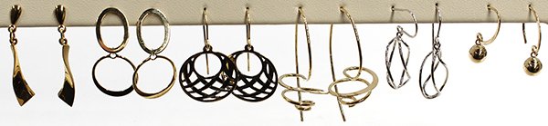 Collection of white yellow gold dangle drop earrings: (Lot of 6) Pairs of drop earrings all mounted in 14K gold; (5) pairs in yellow gold and (1) pair in white gold; Combined total weight approximately 12.0 grams Accompanied by earring display stand Prov